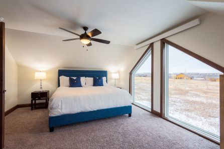 Upstairs primary king bedroom with couch pullout 