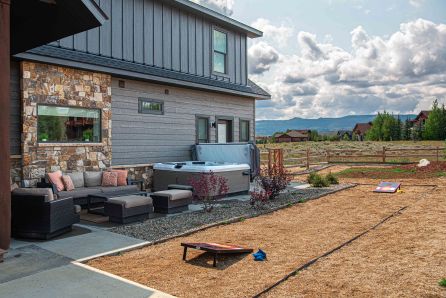 Unwind in the hot tub or play a game of cornhole